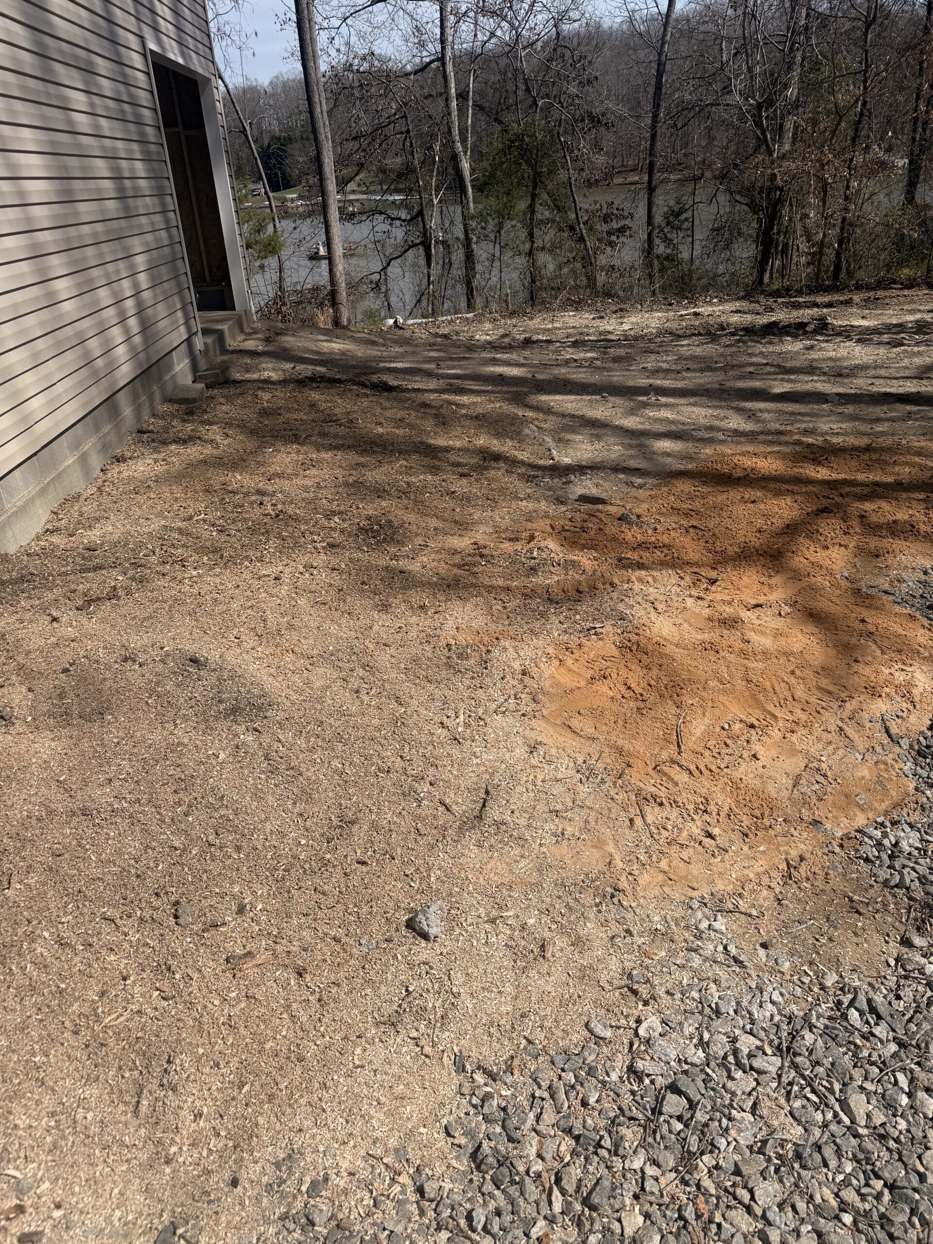 Stump ground below grade and raked level after 316 Tree Services stump grinding
