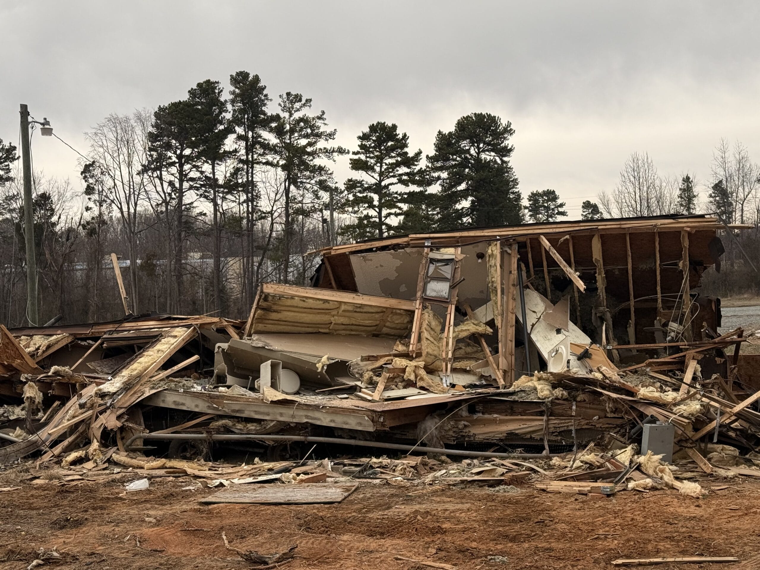Demolished mobile home piled up and ready to haul off